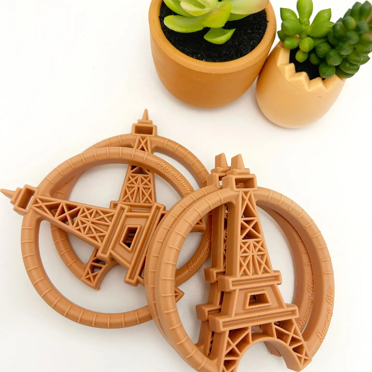 Paris silicone teething toy in vintage design featuring Eiffel Tower shapes and playful textures.