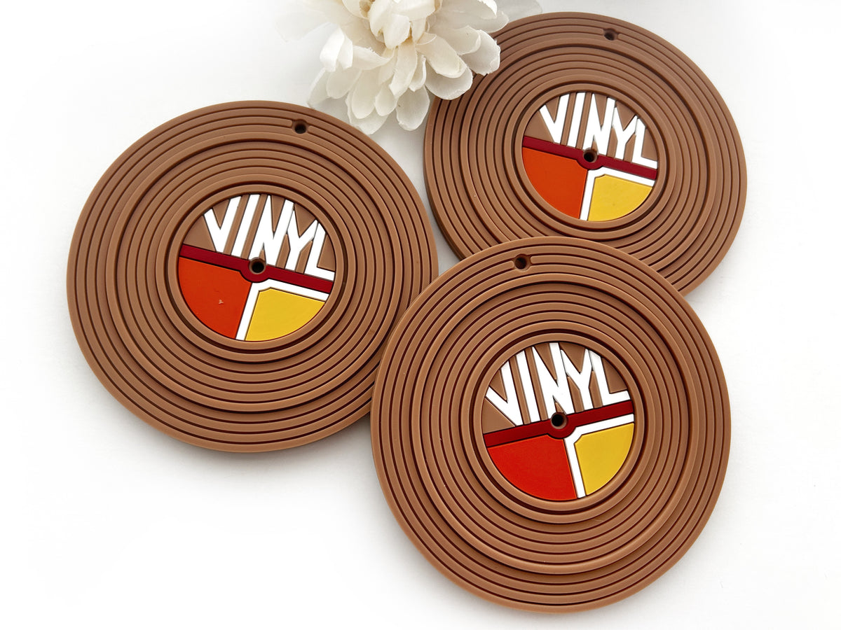 Vinyl record silicone baby teether toy featuring multiple colors and grooves for teething comfort.