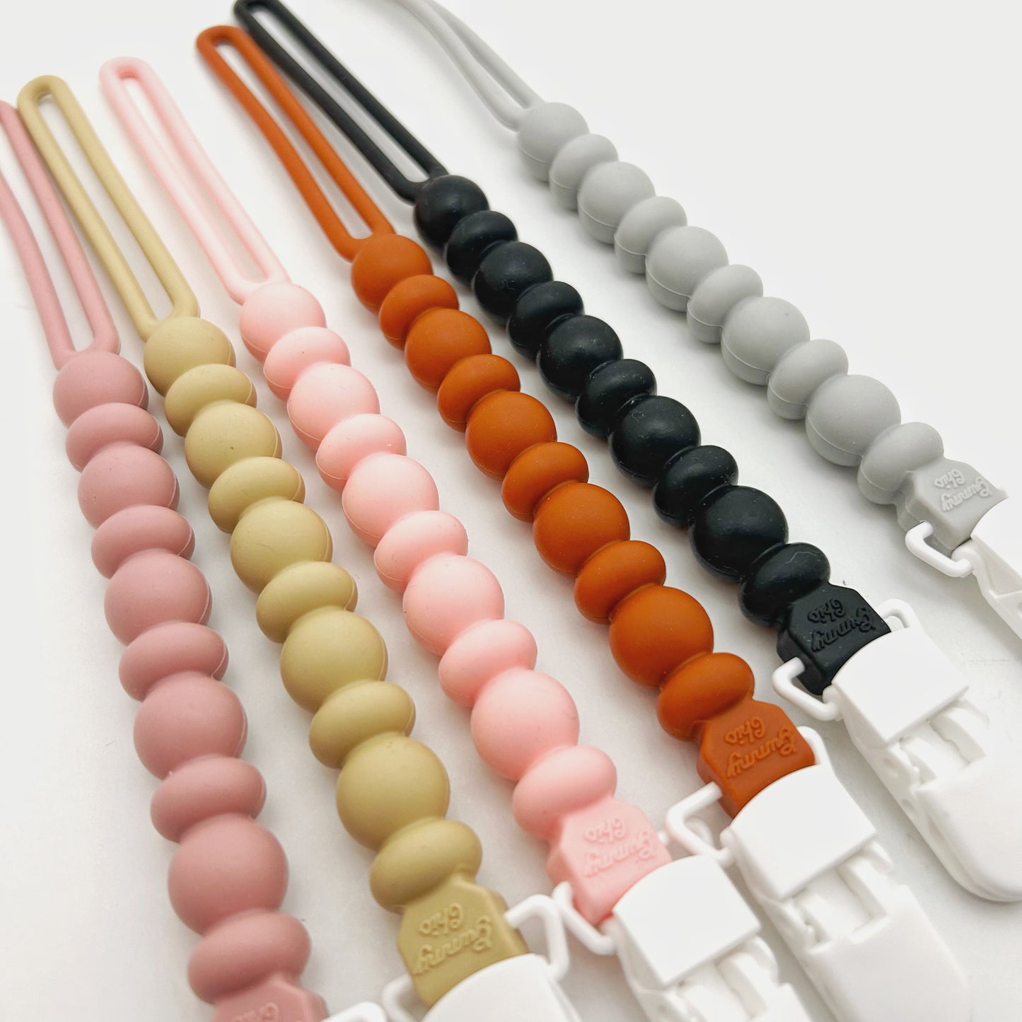 Colorful silicone beaded straps on a white background