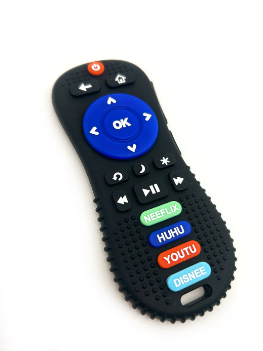 A silicone teether designed to resemble a remote control, with blue, red, and gray buttons and a black textured edge.