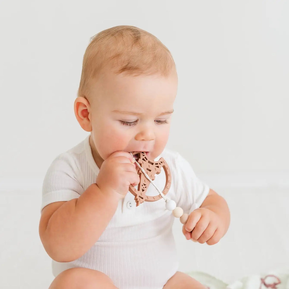 Paris silicone teething toy with dual textures and attached strap