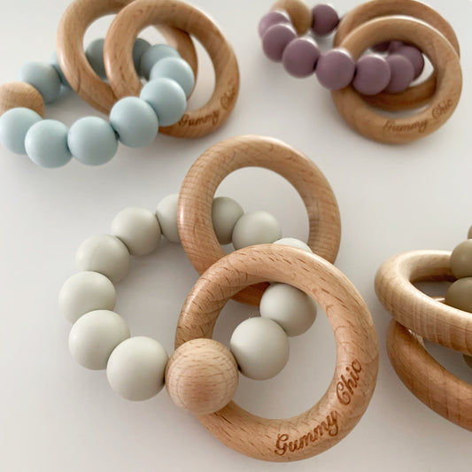 pastel colored silicone ring rattles for babies