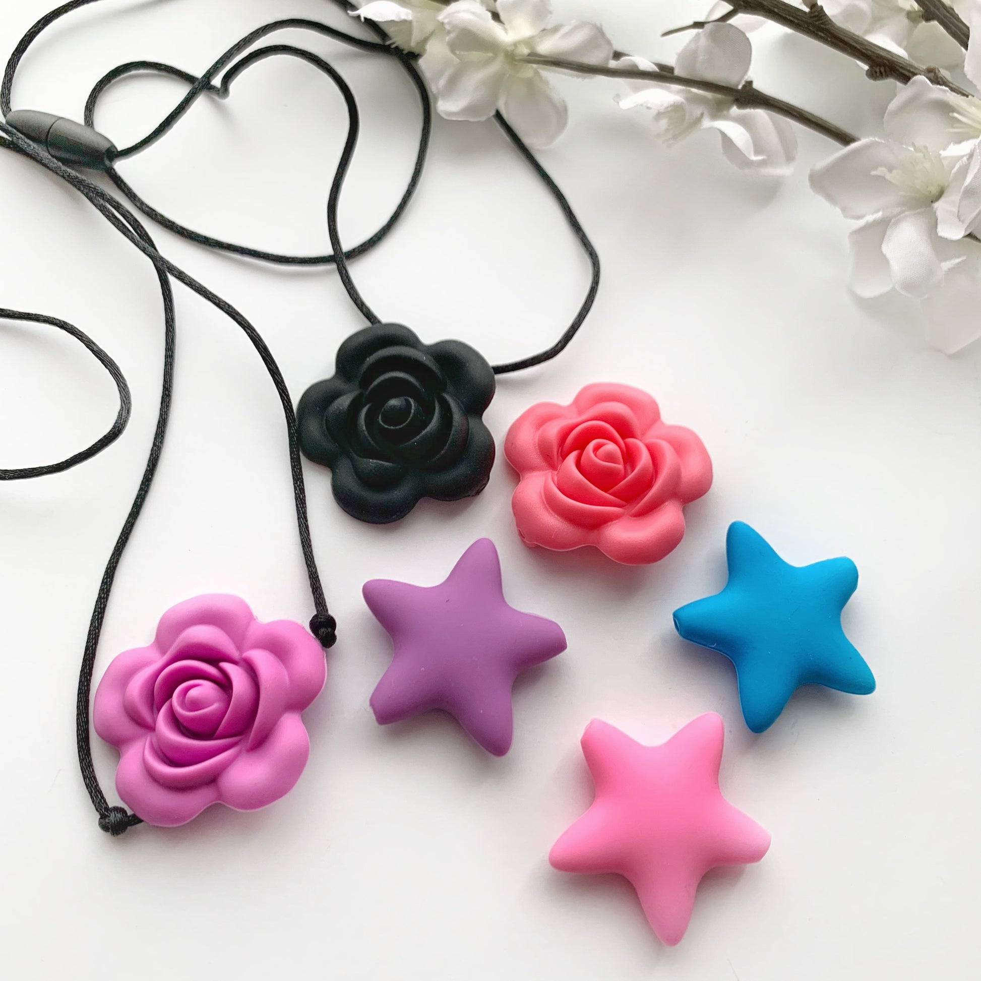sorted roe and star  silicone chew pendants
