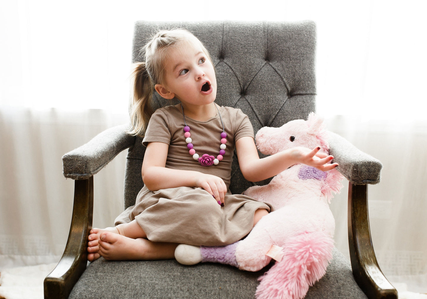 Girl using a sensory necklace