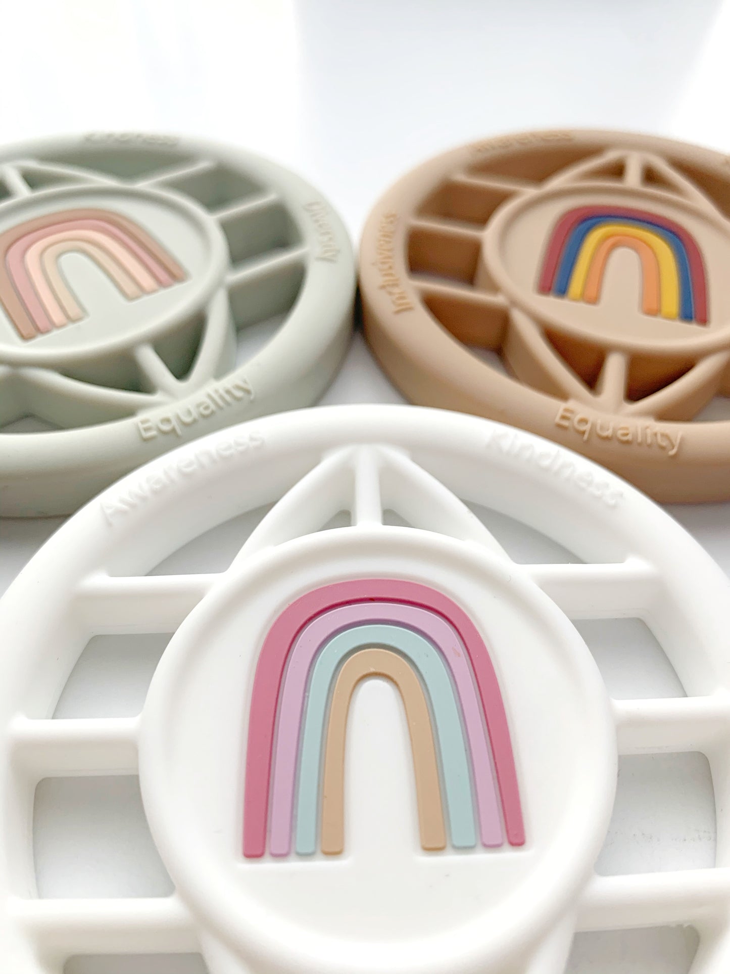 all inclusive writing on the teether around the rainbow teether