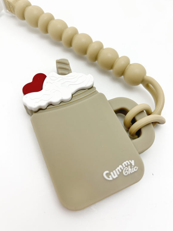 chocolate milkshake teether with a clip for babies to chew on