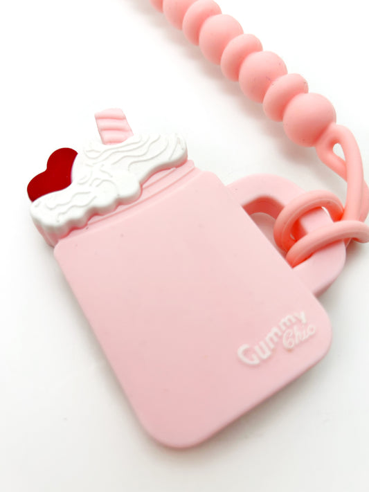 pink milkshake teether toy with a clip to attach baby gift