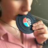 girl chewing on a silicone vinyl record chew