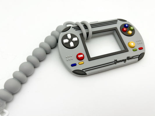 grey video game silicone teether