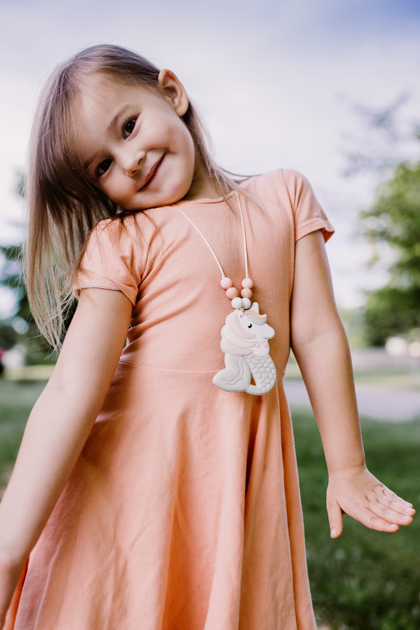 mermicorn necklace in peach and pink