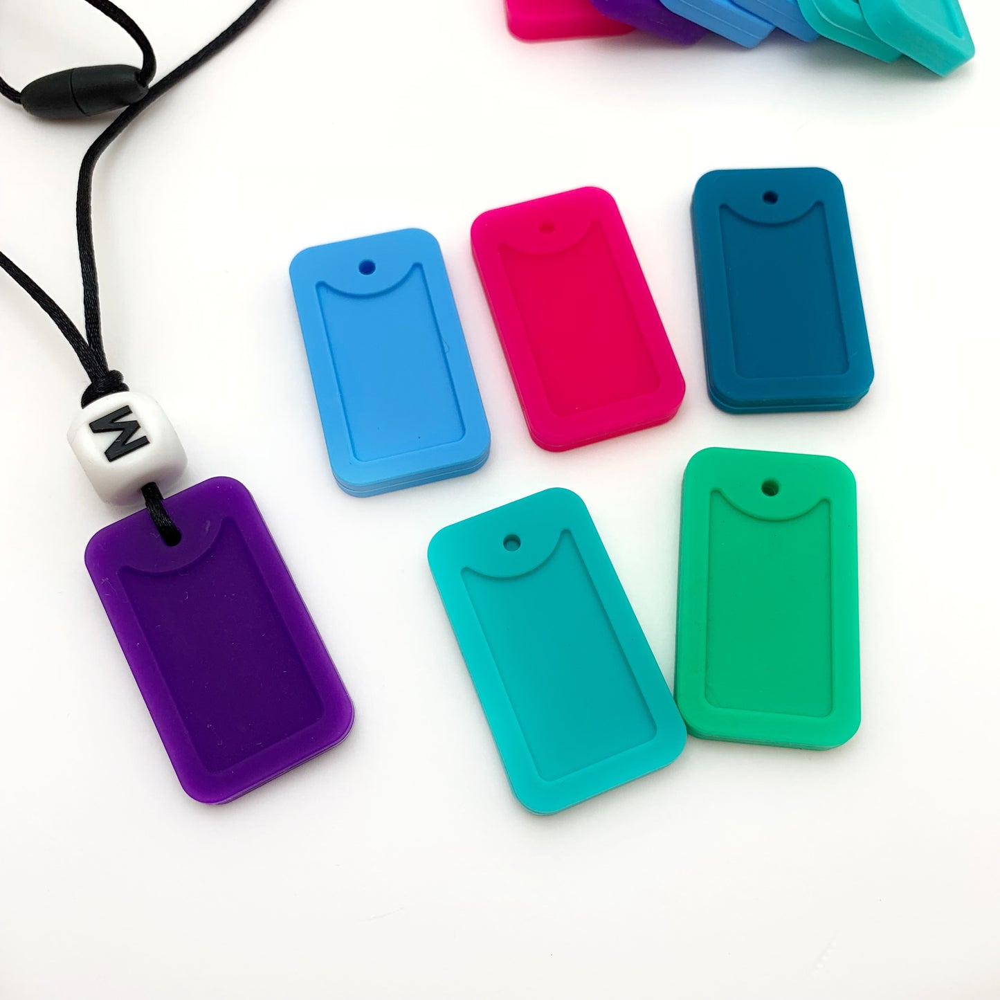 colorful silicone dog tag necklaces with a white silicone letter bead on top for chewing 